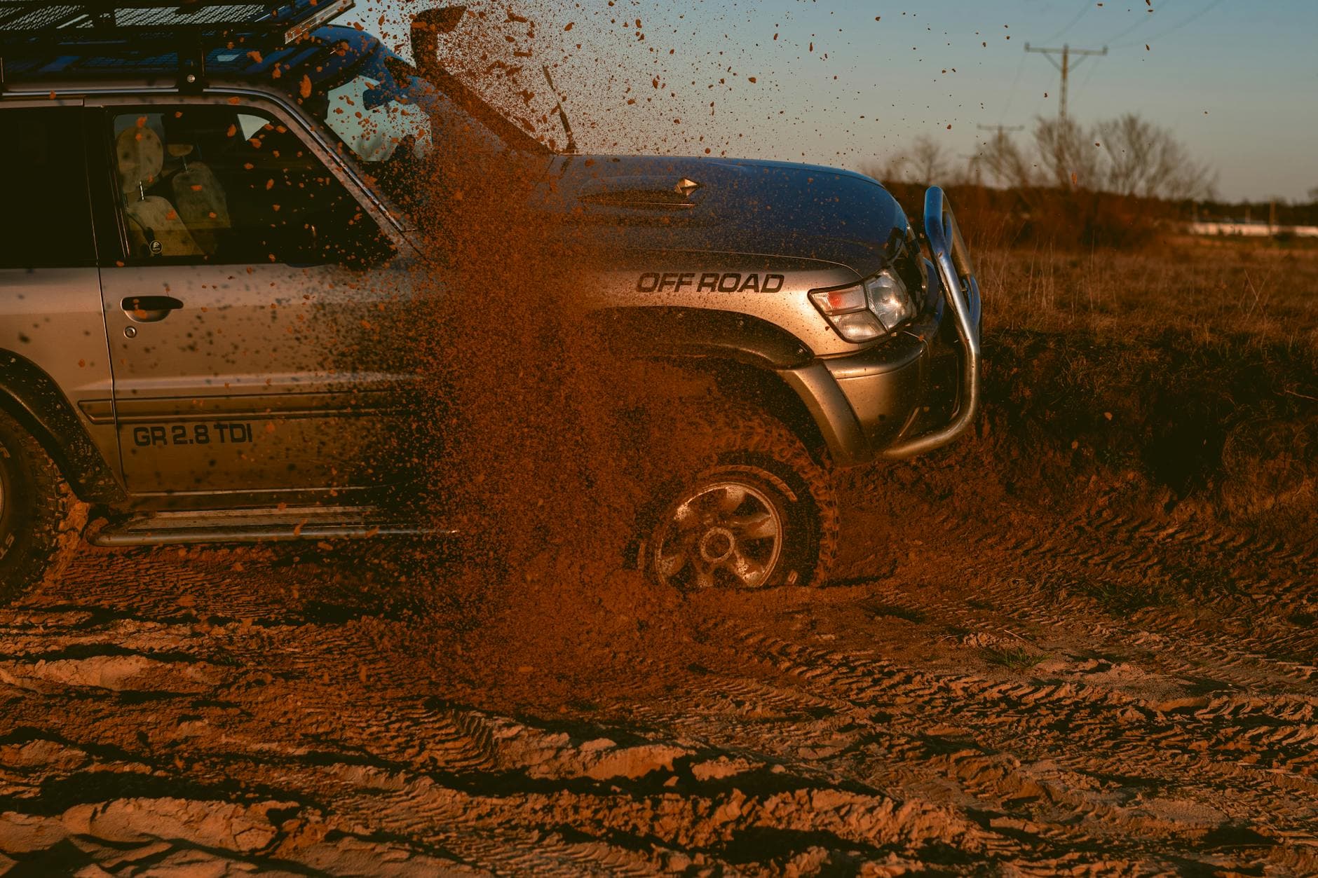 Four wheel drive kicking up dirt