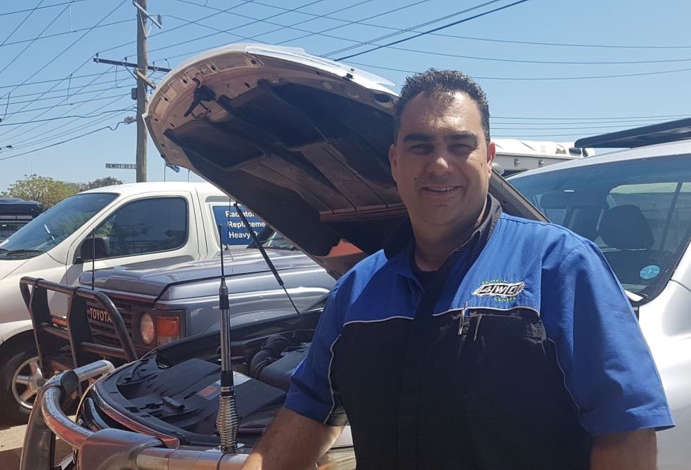 Workshop owner working on a vehicle